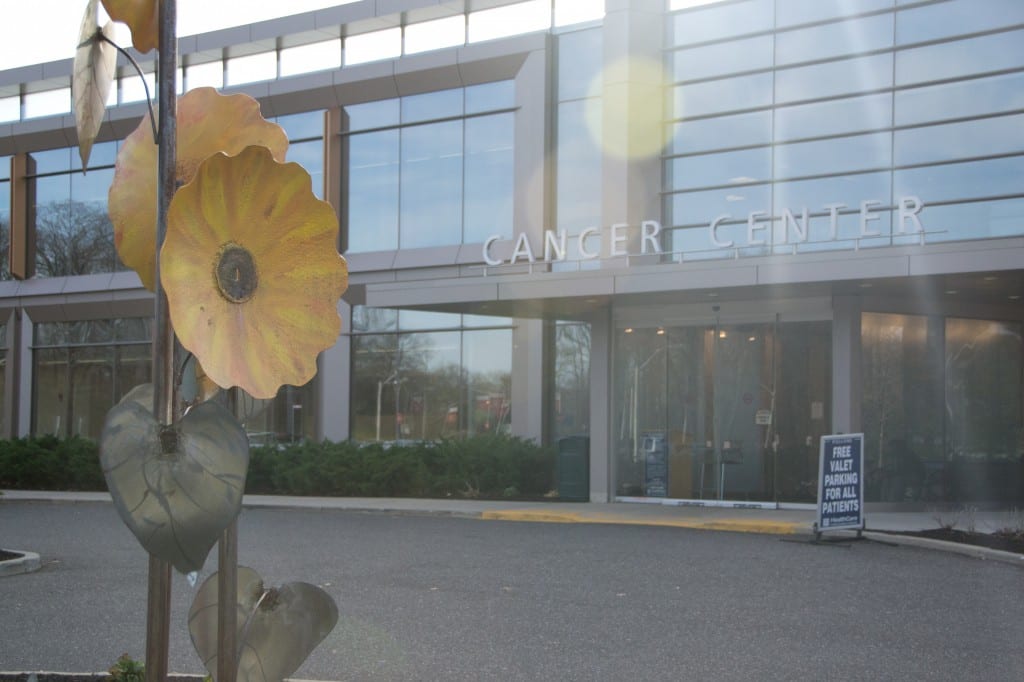 Paintings of flowers line the hallways of the Stony Brook University Cancer Center, while outside a sunflower sculpture by a patients husband stands to welcome new patients. EFAL SAYED/STATESMAN FILE