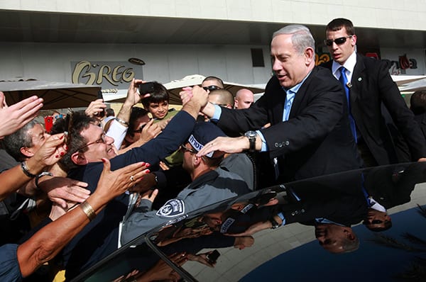 Israels Prime Minister Benjamin Netanyahu shakes hands with Israeli citizens during a visit to the southern city of Ashdod, January 22, 2013. (Yossi Zamir/Flash 90/MCT)