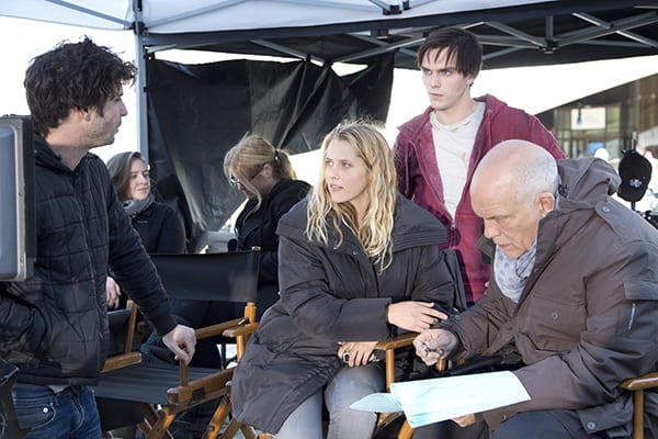 John Malkovich joins Hoult and Palmer behind the scenes of Warm Bodies. (MCT CAMPUS)