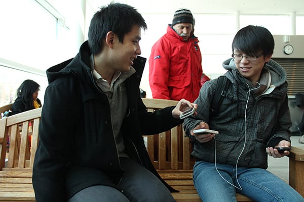 Andy Wong, left, and Vincent Dai, right, scan for points using the Phewtick app. (MIKE RUIZ / THE STATESMAN)