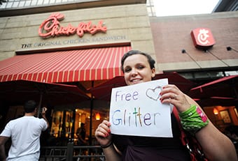 A protester offers free glitter outside a Chick-fil-A restaurant in Crystal City, Virginia, Friday, August 3, 2012. 