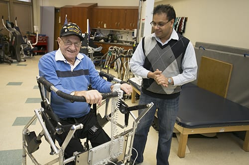 Michael Gernomino, a resident at the Long Island State Veterans Home, tests Anurag Purwars mobility device. (PHOTO CREDIT: STONY BROOK UNIVERSITY)