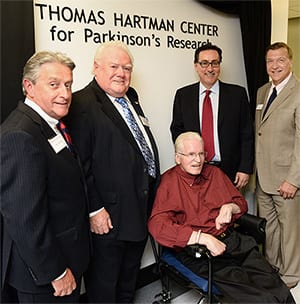Left: Doug Manditch, Joe Collins, Father Tom Hartman, Ernie Canadeo and  President Samuel L. Stanley Jr. unveil the new Parkinsons Research Center at Stony Brook. (PHOTO CREDIT: SBU MEDICINE)