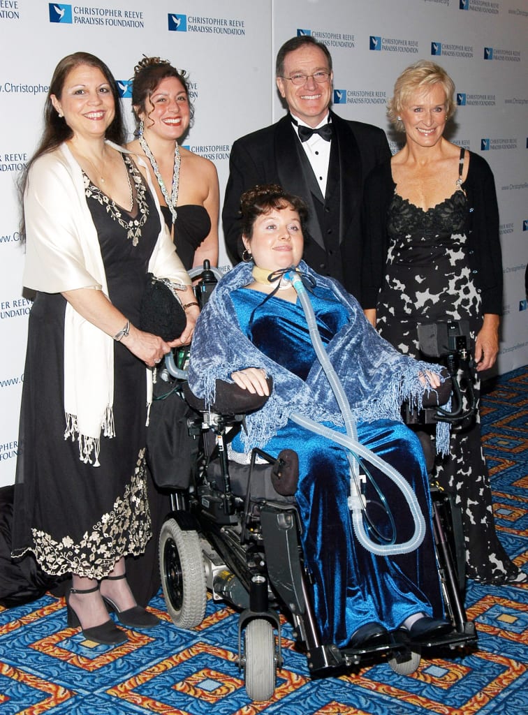 Brooke Ellison, shown above center, with her family at a Reeve Foundation gala in 2004, allowed researchers to test a mobile solar generator at her home for six months (PHOTO CREDIT : MCT CAMPUS)