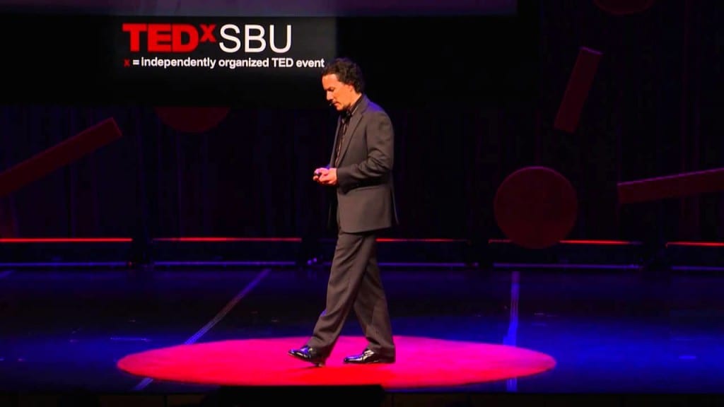 Professor Turhan Canli speaks at a Tedx talk that asks the question Is depression an infectious disease? (PHOTO CREDIT: YOUTUBE.COM/TEDx TALKS)