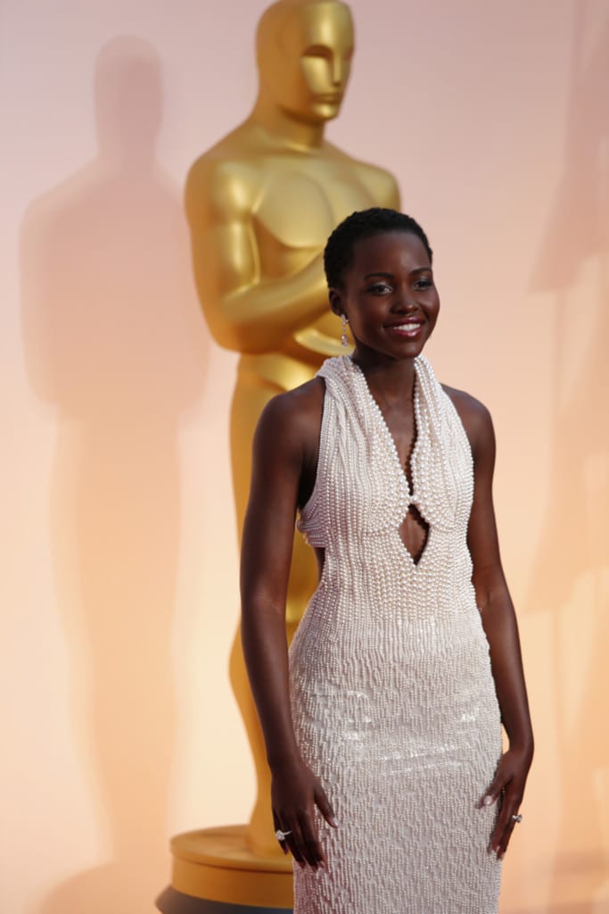 Lupita Nyong’o stood out with her amazing dress at the Oscars. PHOTO CREDIT: JAY L. CLENDENIN