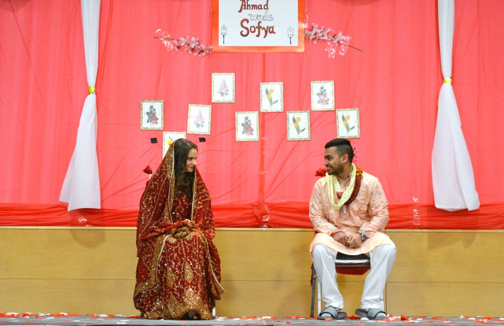 Students Sofya Pugach, left, and Ahmad Fordous on Saturday, Feb. 28, 2014 at the third annual Bengalis Unite Mock Wedding. The ceremony aimed to give Stony Brook University students a taste of Bengali wedding culture. CHRISTOPHER CAMERON / THE STATESMAN