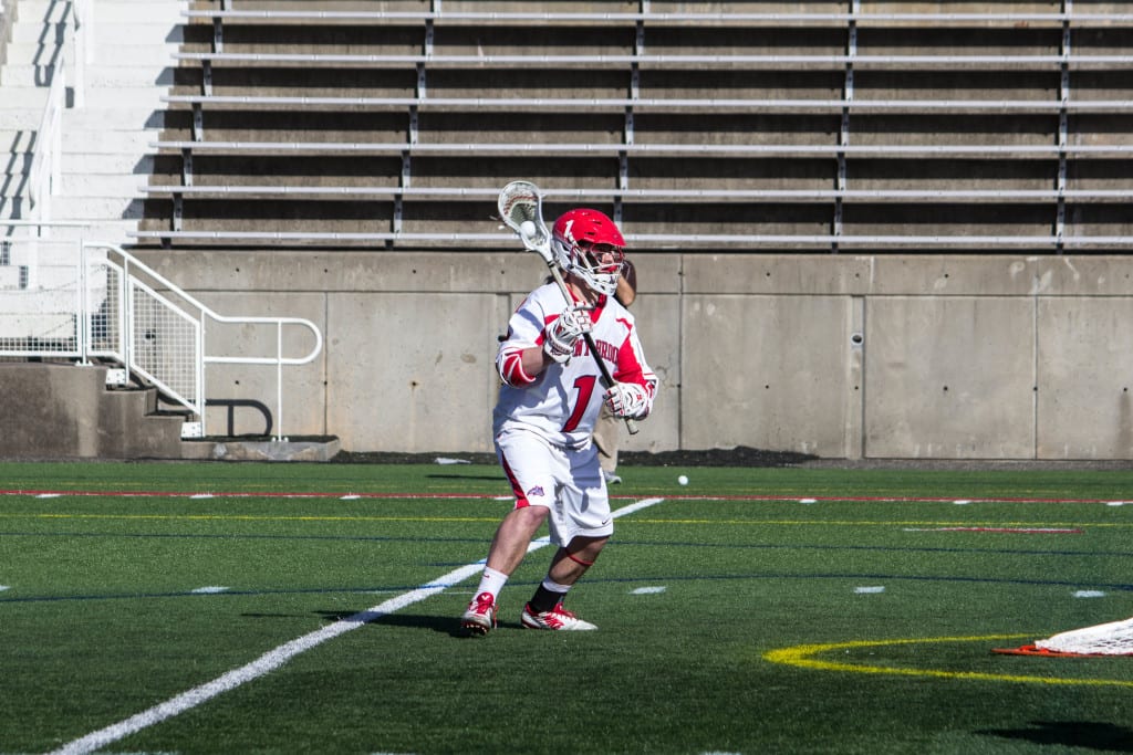 Rooney, No.1 above, is one of the most decorated lacrosse players on Stony Brook’s team. He is the leader in points and assists. MANJU SHIVACHARAN / THE STATESMAN