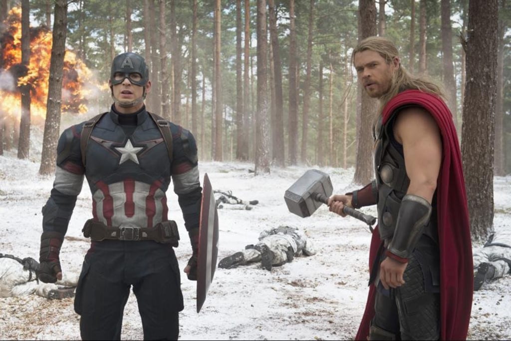 Chris Evans, left, and Chris Hemsworth, right, returned to play characters Captain America and Thor in the sequel. (PHOTO COURTESY: MARVEL/TNS)