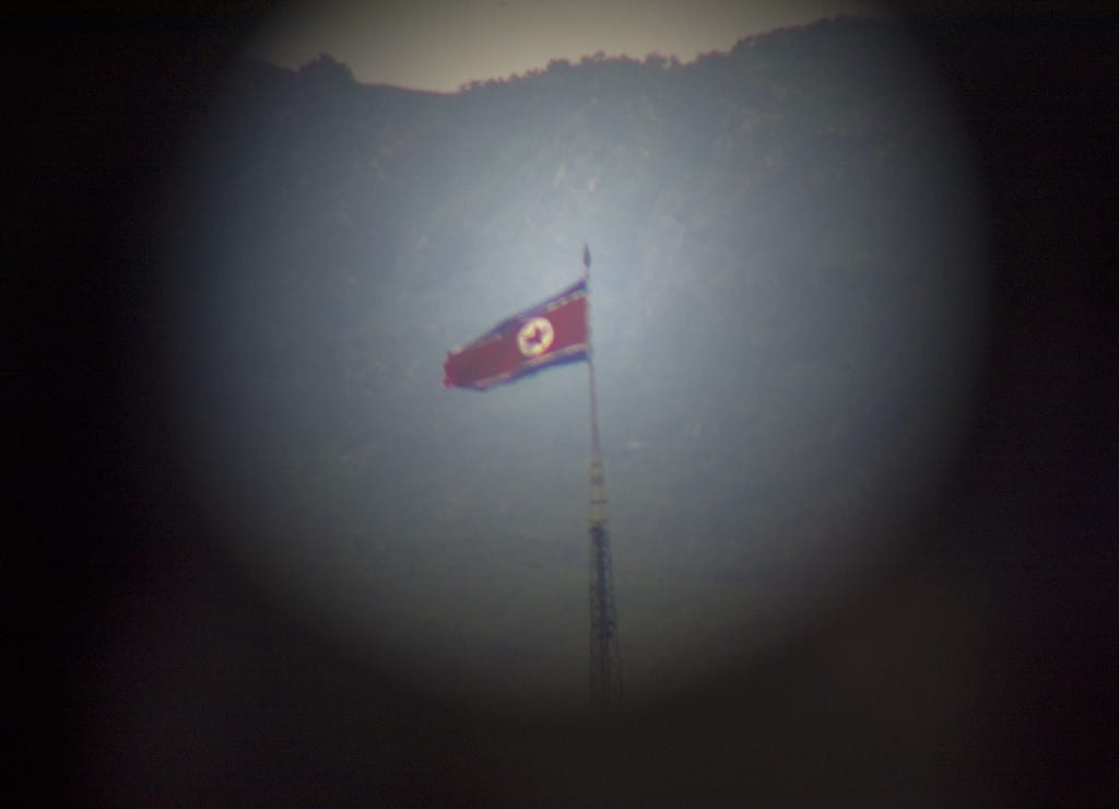 The Panmunjeom flagpole in Peace Village on the northern side of the Korean DMZ, as seen through a telescope at the Dora Observatory. The flagpole was constructed in the 80s in response to the South Korean flagpole that had been built in the Freedom Village, and is the 4th tallest flagpole in the world. (CHRISTOPHER CAMERON/THE STATESMAN)
