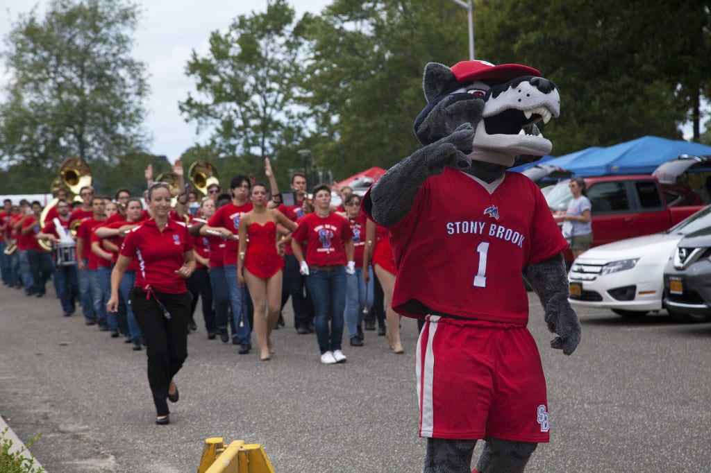 Wolfie leading the Spirit of Stony Brook marching band from The Lot to Kenneth P. LaValle stadium for the football game against Central Connecticut. GISELLE MIRANDA/THE STATESMAN