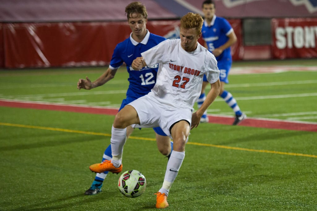 Sophomore forward Vince Erdei (above, No. 27) dribbles the ball against Buffalo. He has scored four goals in his last four games, marking the best stretch of his college career. HANAA TAMEEZ/THE STATESMAN