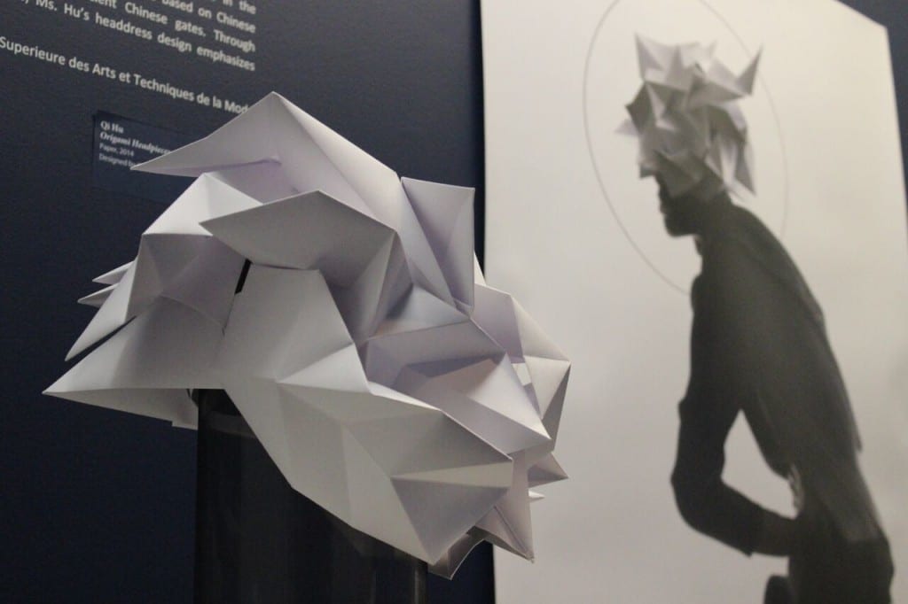 Fashion designer Qi Hu created this paper headdress inspired by origami techniques and Asian culture.  TAYLOR HA/THE STATESMAN