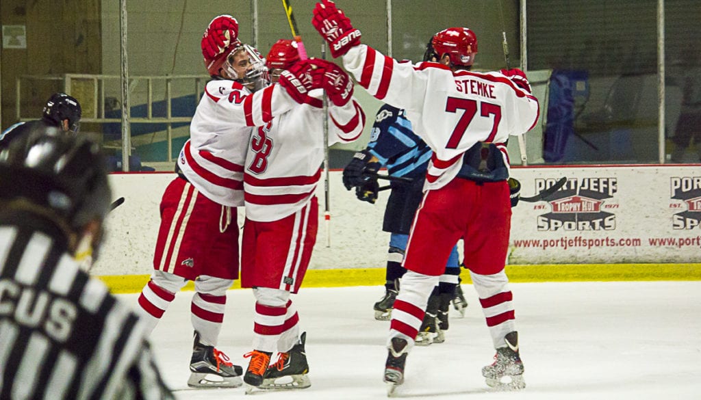 The Stony Brook hockey team celebrates after a game against the University of Rhode Island.  KELLY ZEGERS/STATESMAN FILE