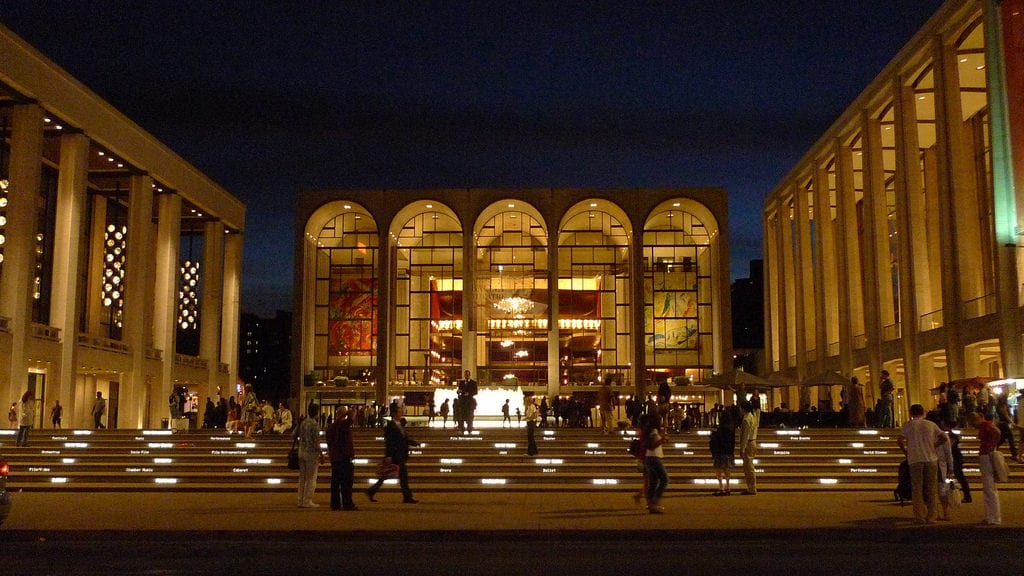 Lincoln Center in New York City, with the David H. Koch Theater to the left, David Geffen Hall on the right, and the Metropolitan Opera House center. CHUN-HUNG ERIC CHENG/FLICKR VIA CC BY 2.0