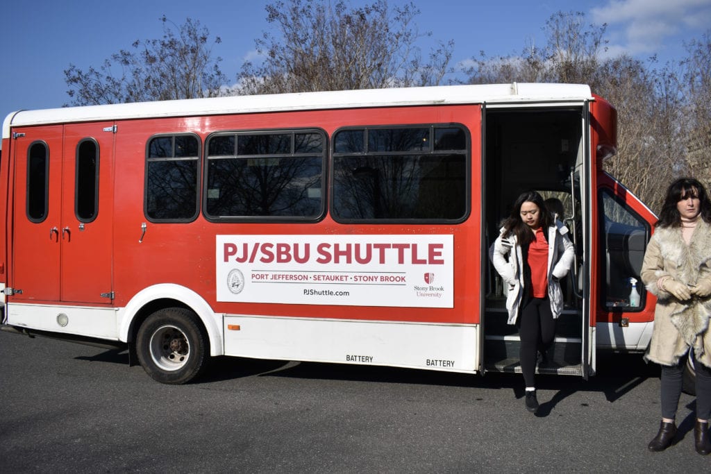 Students leave the Port Jefferson-Stony Brook University shuttle bus on Thursday, March, 7. SARA RUBERG/THE STATESMAN