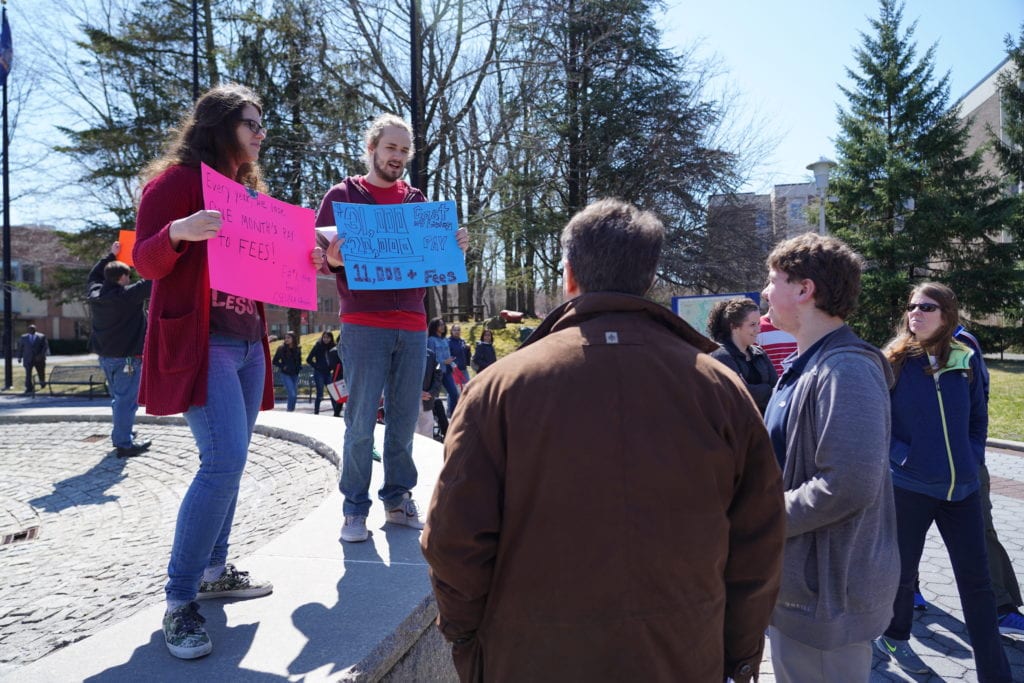 Graduate Student Employees Union members protest increased fees during Stony Brook Universitys Admitted Students Day on Saturday, April 6, at the main fountain outside of the administration building. This year graduate student fees will increase by about $100. GARY GHAYRAT/THE STATESMAN