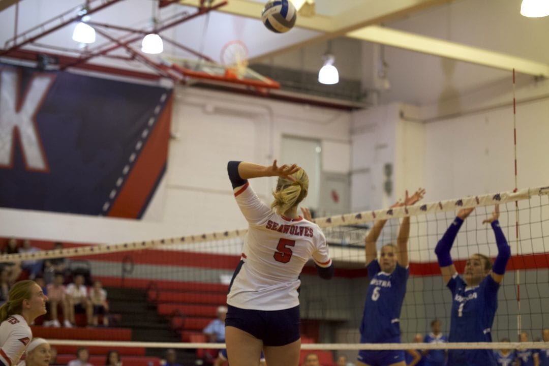 Poole jumps to hit the ball over the net at the Stony Brook Volleyball home opener on Sept. 3. EMMA HARRIS/THE STATESMAN