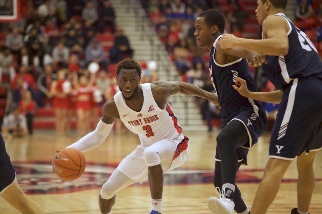 Olaniyi in with the ball during Stony Brook mens basketball home opener on Nov. 5 against Yale. 
 EMMA HARRIS/STATESMAN FILE