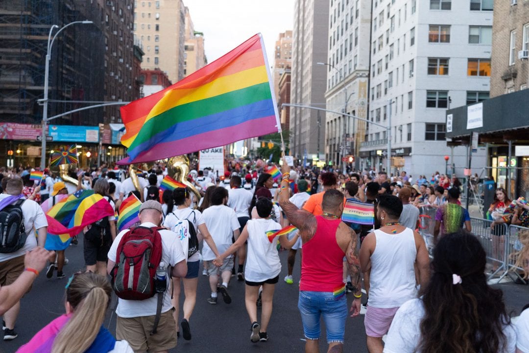 People march with the LGBTQ flag at the Pride parade held on June 30, 2019 in Manhattan, NY.  GARY GHAYRAT/STATESMAN FILE
