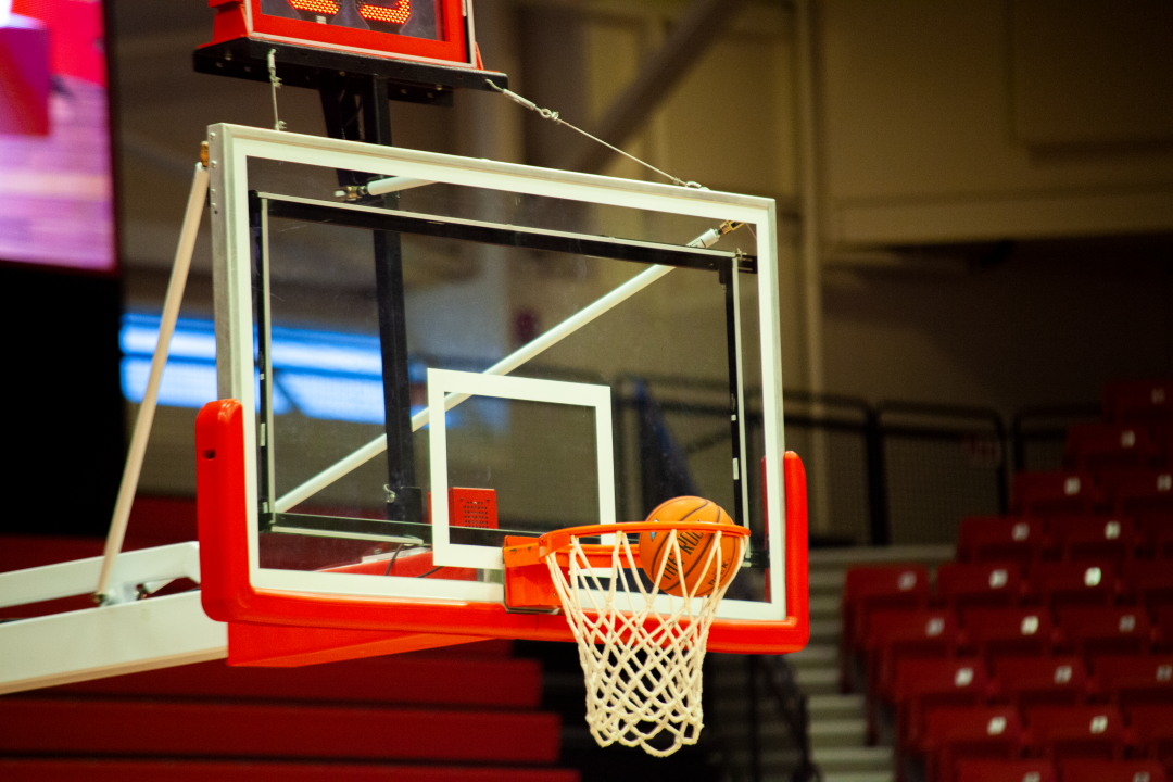 A basketball going through one of the hoops at Island Federal Arena. SARA RUBERG/STATESMAN FILE