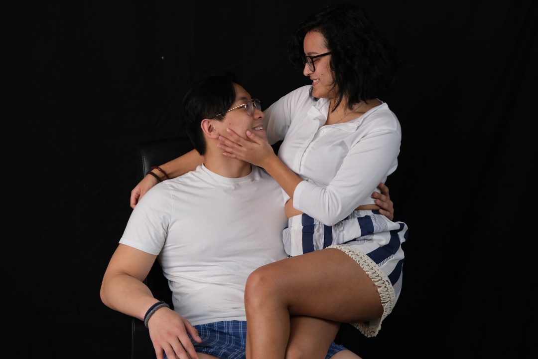 Judi Le, senior Asian and Asian American studies major at Stony Brook university and Bryan Le, senior music major at Stony Brook University  holding hands for The Statesman Sex and Relationships photoshoot. RABIA GURSOY/STATESMAN FILE