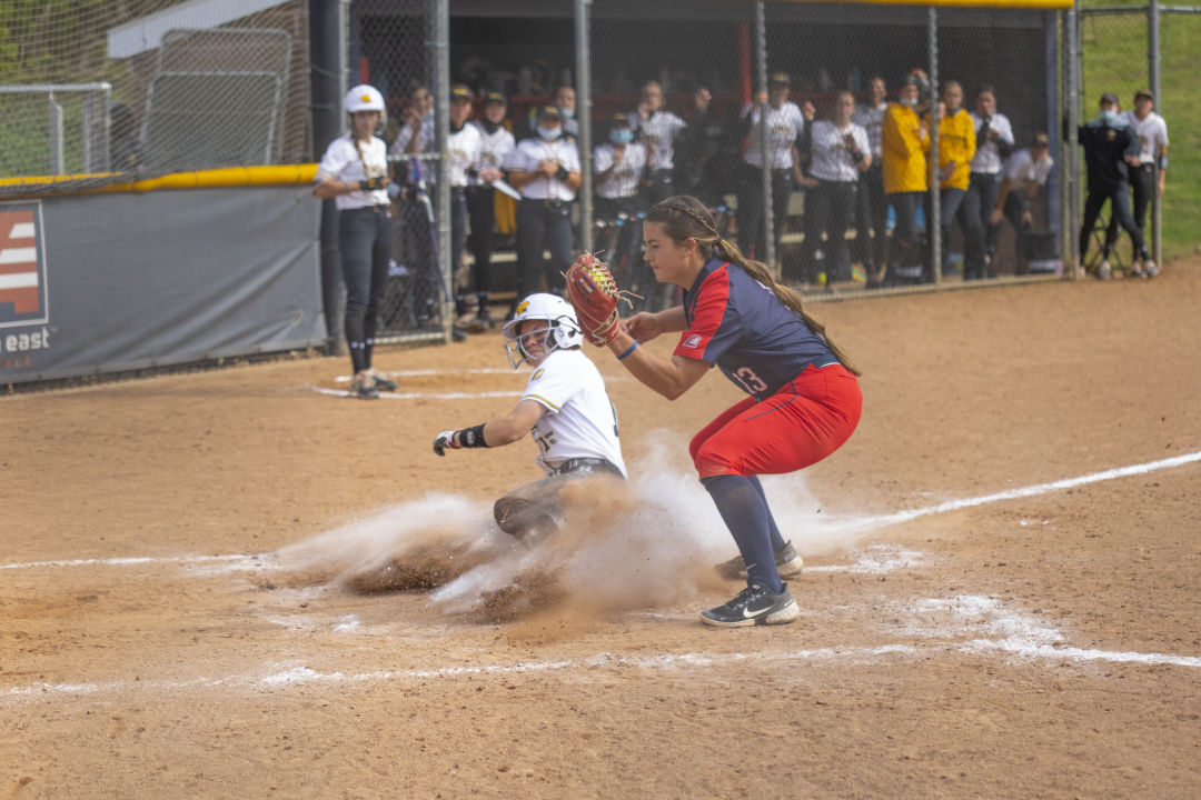Graduate pitcher Melissa Rahrich attempting to tag out a runner on a wild pitch against UMBC on May 7.