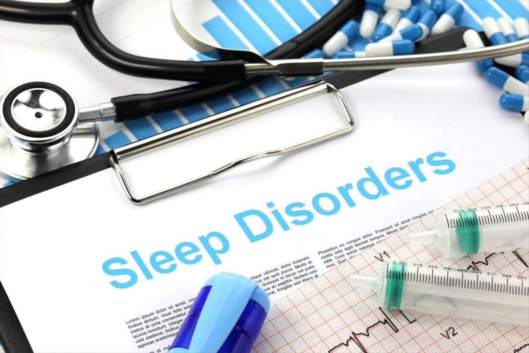 Sleep Disorders written on a paper on a clipboard that is surrounded by pills, a stethoscope, and syringes. NICK YOUNGSON/ALPHA STOCK IMAGES