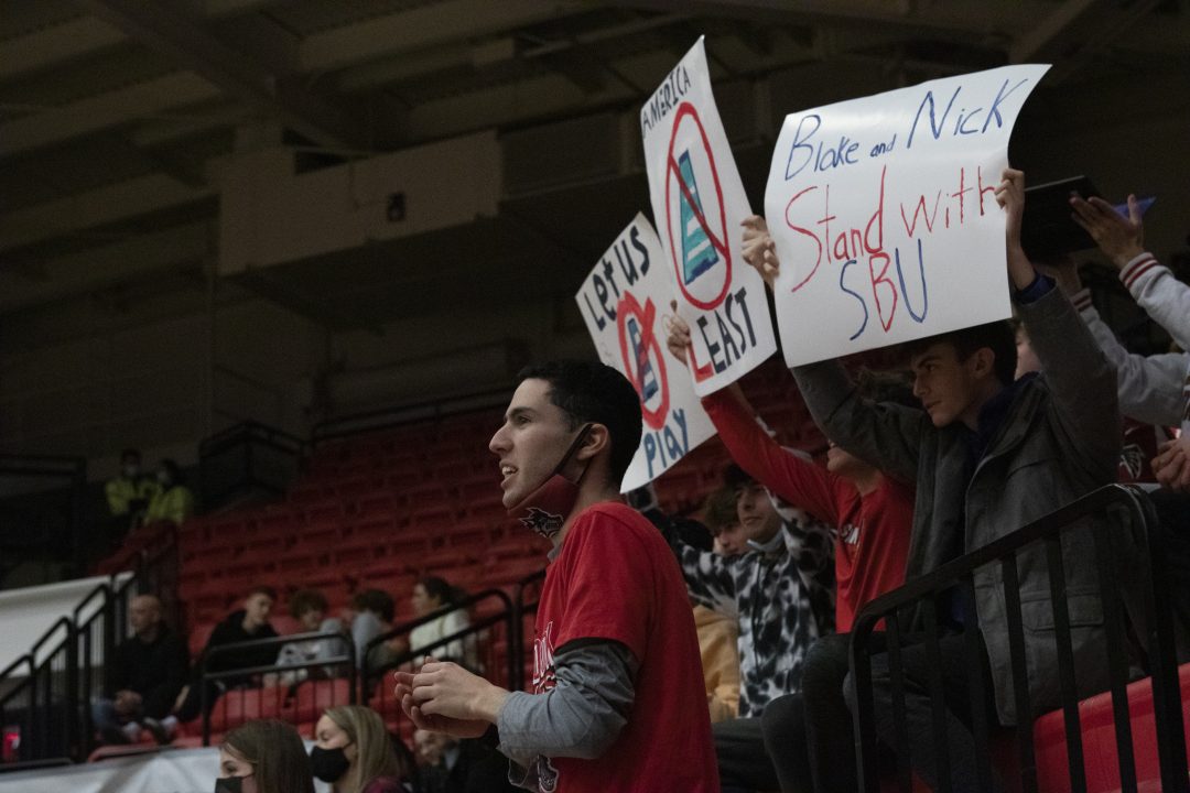 Protesters at the game against UMass Lowell. ETHAN TAM/THE STATESMAN