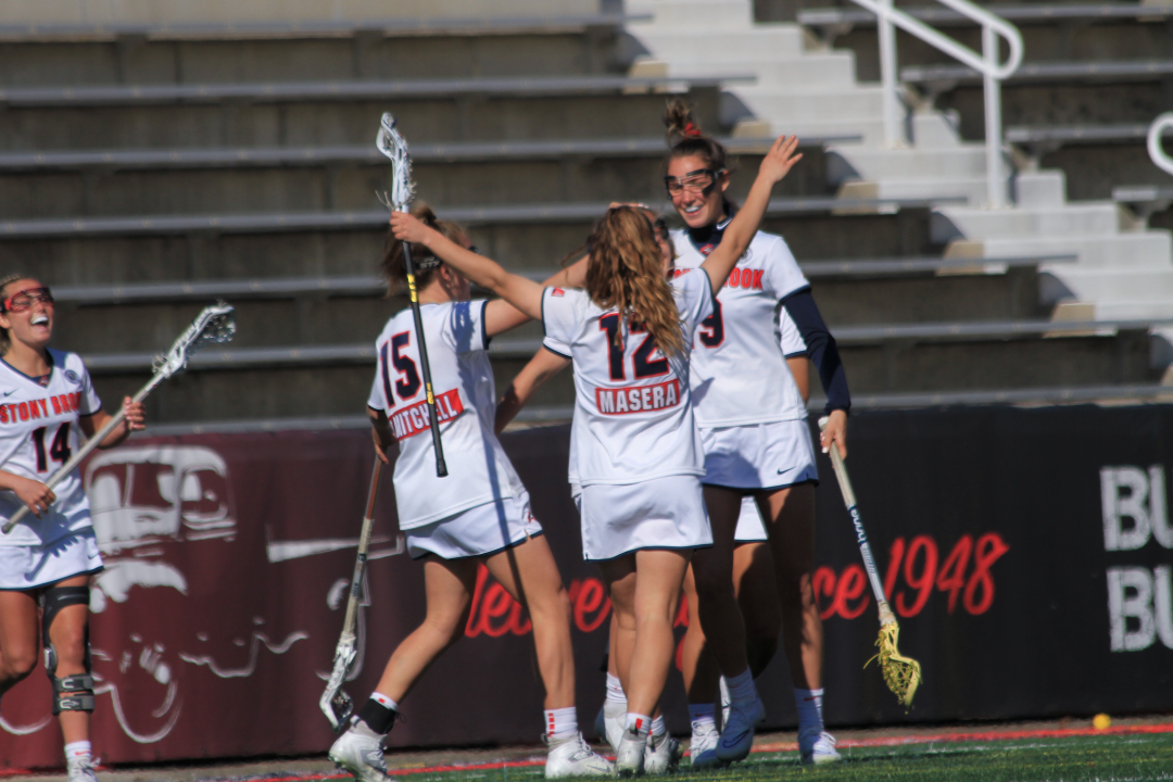 The womens lacrosse team going in for an embrace after a goal was scored. KAT PROCACCI/THE STATESMAN