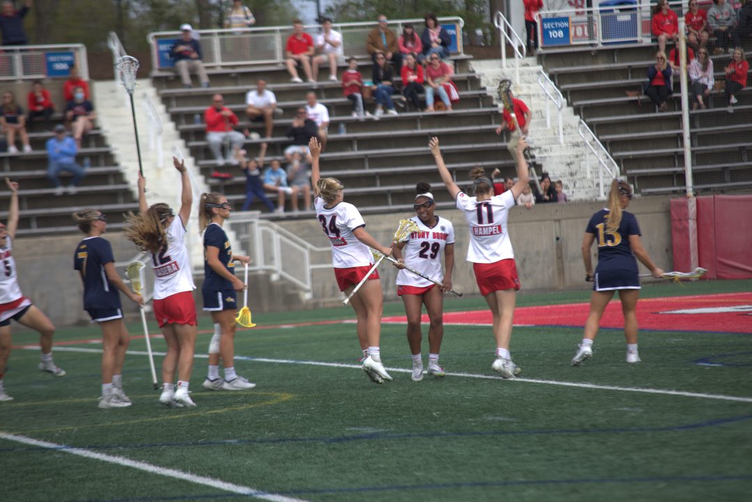 The Stony Brook womens lacrosse team celebrates during a game against Drexel on May 13. The Seawolves advanced to the third round of the NCAA Tournament by beating Rutgers 11-7 on Sunday. ETHAN TAM/THE STATESMAN