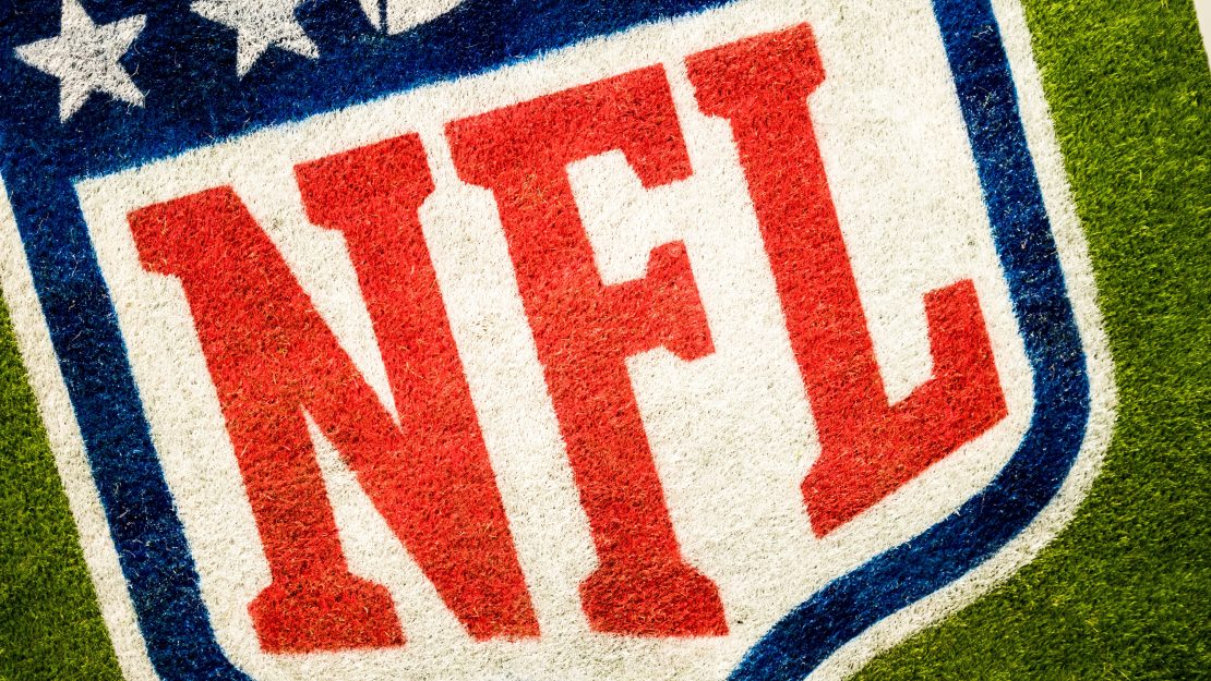 A football field with the National Football League (NFL) logo on it. ADRIAN CURIEL/PUBLIC DOMAIN