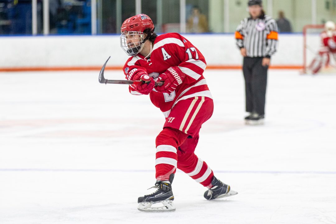 Defenseman Rob Distefano attempting a shot in a game against Syracuse on Oct. 1. The Stony Brook club hockey team swept its second straight series to open the new season. PHOTO COURTESY OF DAVID HERMAN