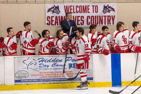 Forward Devin Pepe fist-bumping with his teammates before the Stony Brook hockey teams home opener. Pepe is now the team captain and has helped lead the Seawolves to a 7-0-0 start. PHOTO COURTESY OF AZTEKPHOTOS