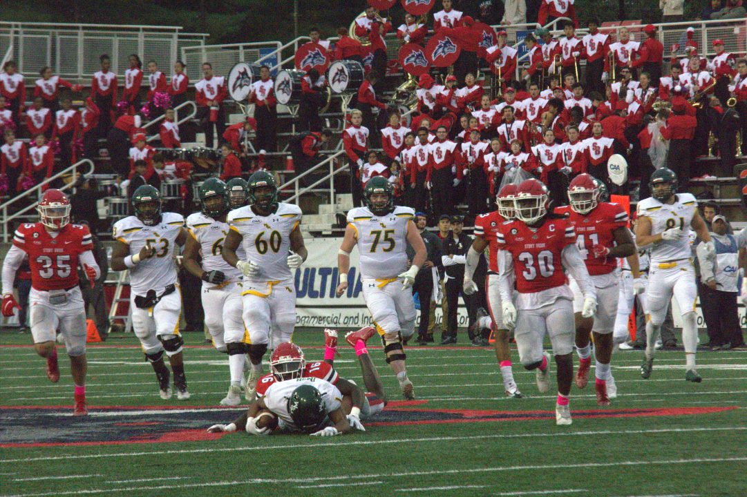 Cornerback Shamel Lazarus (16) makes a tackle while the rest of the defense follows. The Stony Brook football team will look to grab their first win of the year this Saturday at New Hampshire.