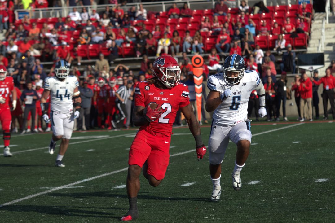 Running back Jayden Cook running the ball on Saturday, Oct. 22. The Stony Brook football team was blown out by Albany on Saturday in the eighth annual Battle for the Golden Apple. CAMRON WANG/THE STATESMAN
