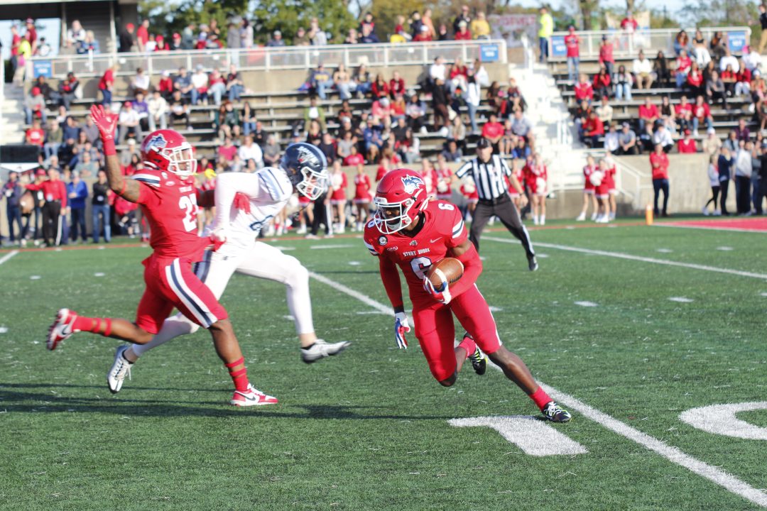 Wide receiver Tedy Afful returning a punt while receiving a block from safety Jordan Jackson on Saturday, Oct. 22. The Stony Brook football team is back home this Saturday against Morgan State, where it will look for its second win of the season. CAMRON WANG/THE STATESMAN