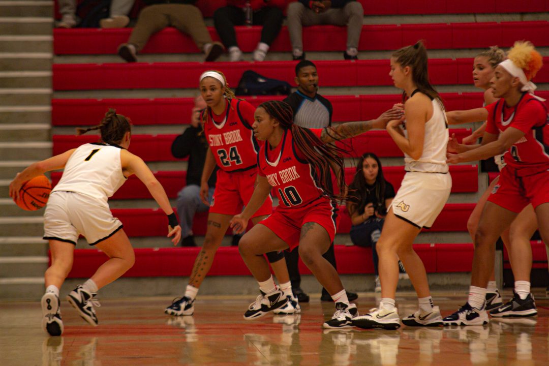 Guards Daishai Almond, Erin Turral and Annie Warren playing defense in the exhibition against Adelphi on Thursday, Nov. 3. The Stony Brook womens basketball team is loaded with quality guards, posing a threat to the rest of the conference. TIM GIORLANDO/THE STATESMAN