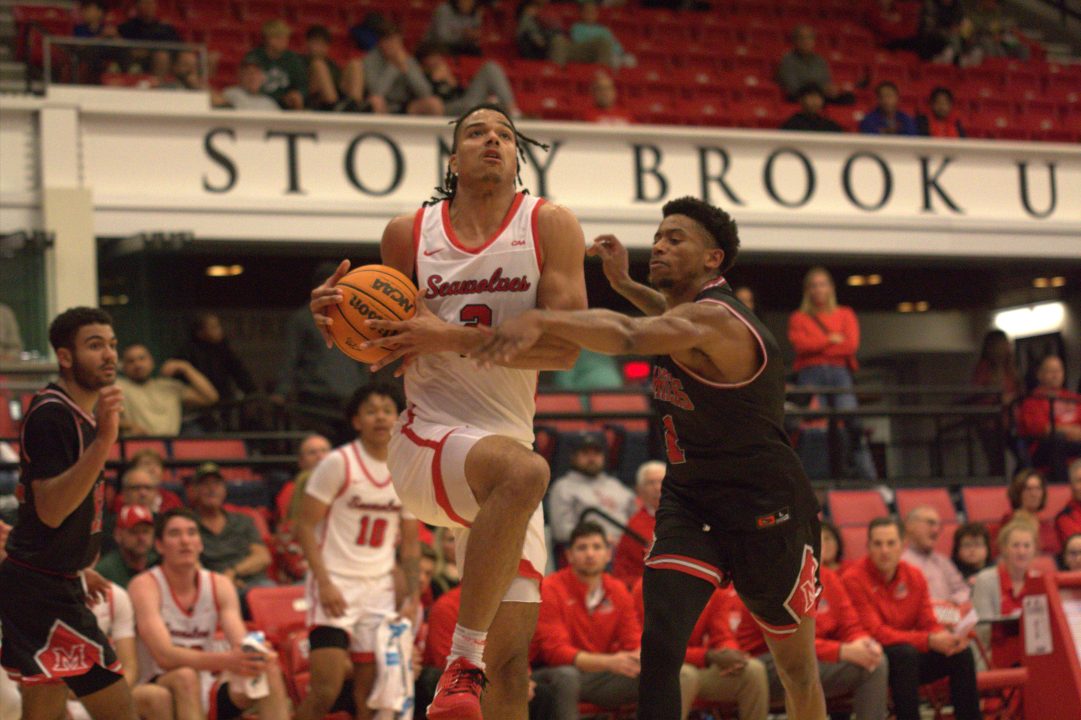 Forward Frankie Policelli driving through contact towards the rim on Friday, Nov. 11. The Stony Brook mens basketball team lost both of its games in the FIU Tournament. CAMRON WANG/THE STATESMAN