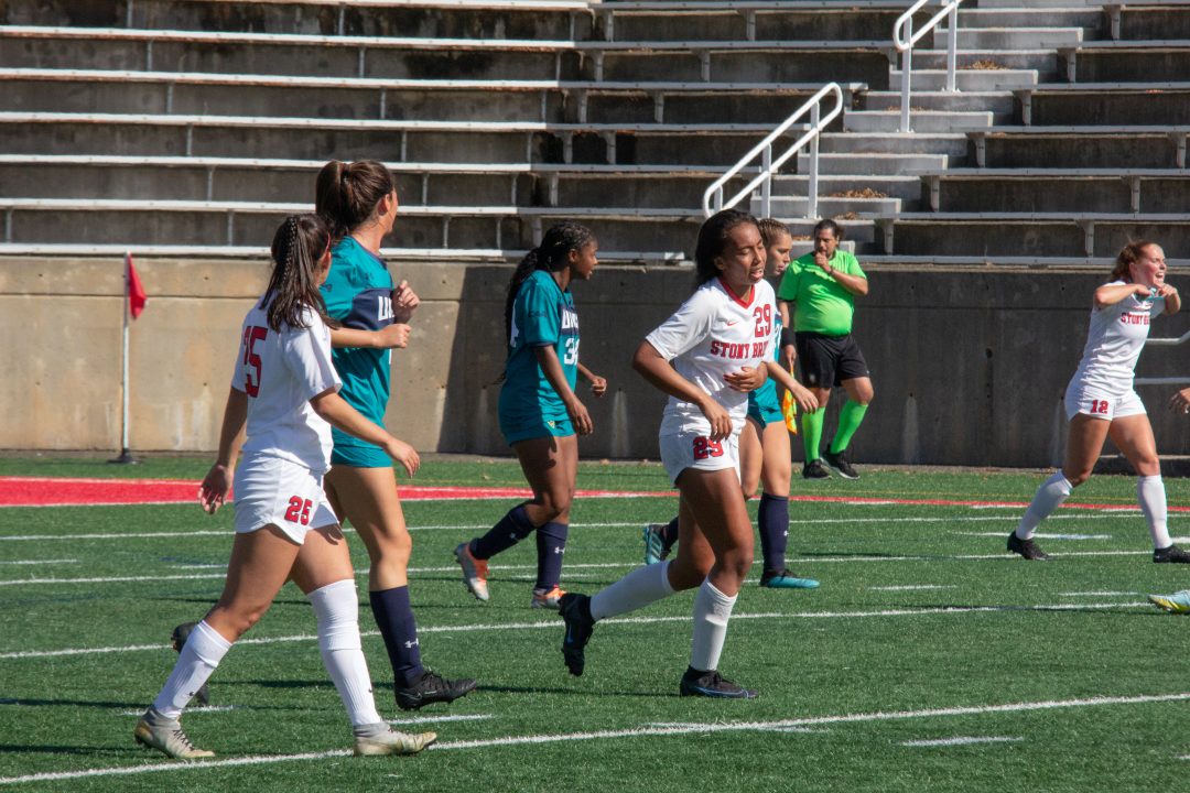 Defender Madison Sleiman (left), midfielder Gabby Daniels (middle) and forward Reilly Rich (right) in a match against UNCW on Sunday, Oct. 16. The three players were key contributors to the Stony Brook womens soccer teams success in the 2022 season. TIM GIORLANDO/THE STATESMAN