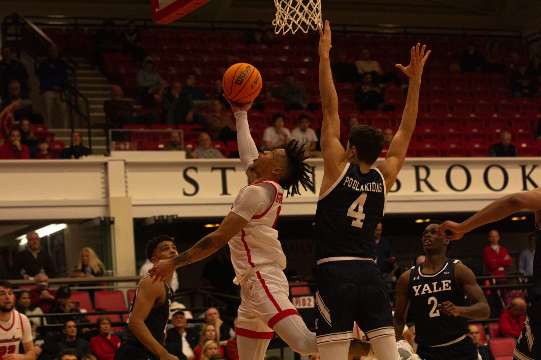 Guard Tyler Stephenson-Moore attempting a reverse layup under the basket against Yale on Saturday, Dec. 3. The Stony Brook mens basketball team fell to 2-7 after losing 79-60 at Bryant. TIM GIORLANDO/THE STATESMAN
