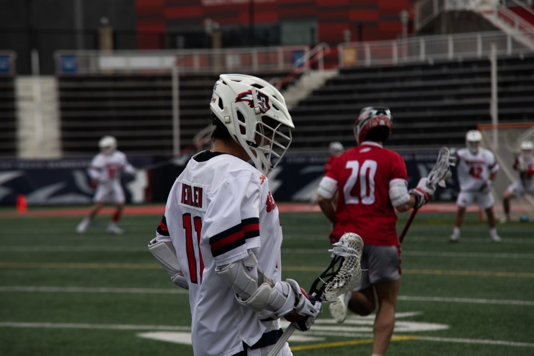 Attackman Blake Behlen in a game against Sacred Heart on Sunday, Feb. 26. Behlen posted a hat trick and led the Stony Brook mens lacrosse team to its second-straight win. TIM GIORLANDO/THE STATESMAN