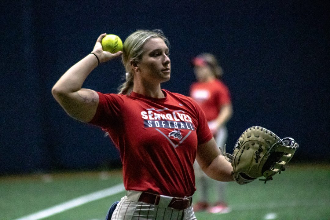 Catcher Corinne Badger having a catch during practice on Friday, Feb. 3. Badger has become one of the nations best catchers after a rough start to her career. BRITTNEY DIETZ/THE STATESMAN