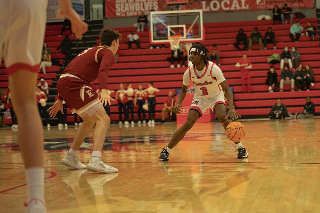 Guard Toby Onyekonwu dribbling the ball on Thursday, Feb. 3. The Stony Brook mens basketball team had a tough night offensively in a 69-55 loss to Elon. CAMRON WANG/THE STATESMAN