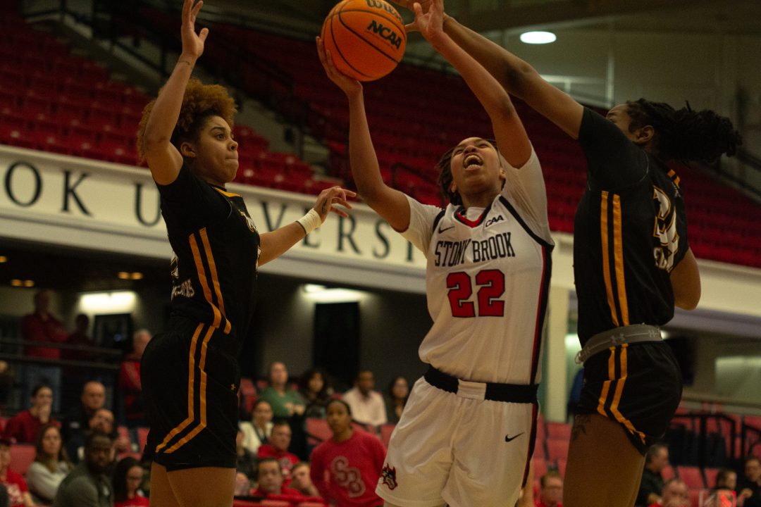 Center Sherese Pittman goes up for a layup through a double team against Towson. A transfer portal acquisition, Pittman is having a breakout season in her first year with the Stony Brook womens basketball team. VIKRAM SETHI/THE STATESMAN