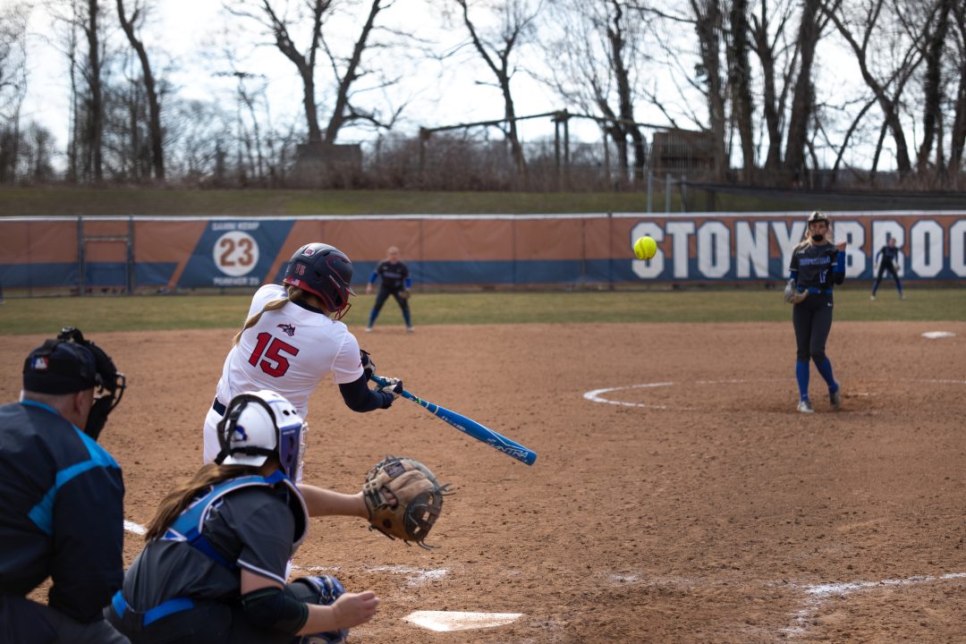First baseman Ashley Jacobson hits a pitch against Hofstra on Saturday, March 18. Jacobson went 4-for-6 with a homer against Drexel on Sunday. TIM GIORLANDO/THE STATESMAN