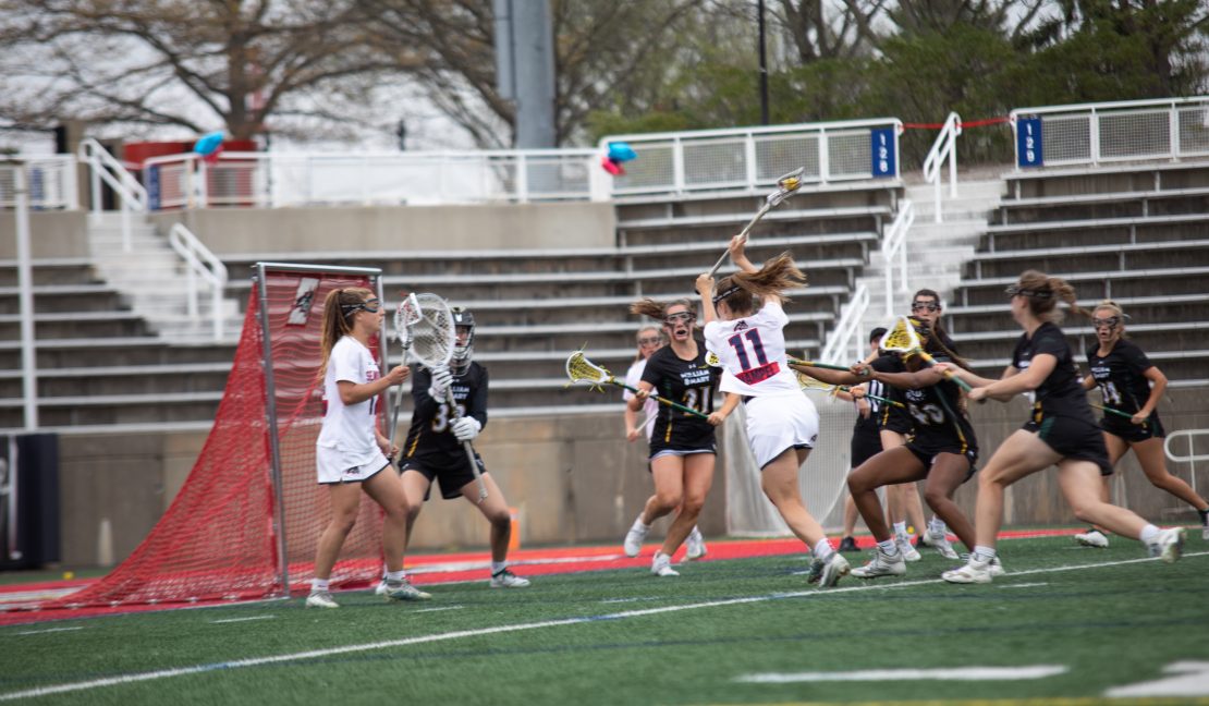 Midfielder Jaden Hampel dodges defenders before attempting a shot against William & Mary on Saturday, April 15. Hampel had a huge day against the Tribe, leading her team to a blowout win. BRITTNEY DIETZ/THE STATESMAN
