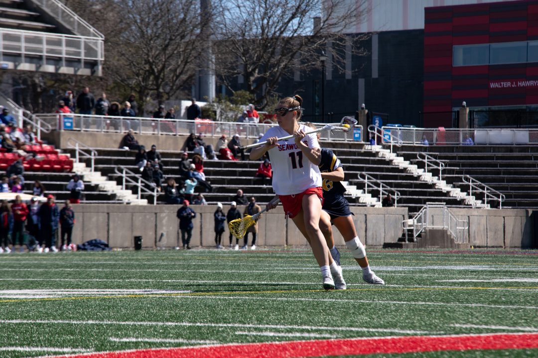Midfielder Jaden Hampel looks to pass the ball against Drexel on Sunday, April 2. Hampel racked up a hat trick of goals and assists to lead the Stony Brook womens lacrosse team past Drexel. TIM GIORLANDO/THE STATESMAN