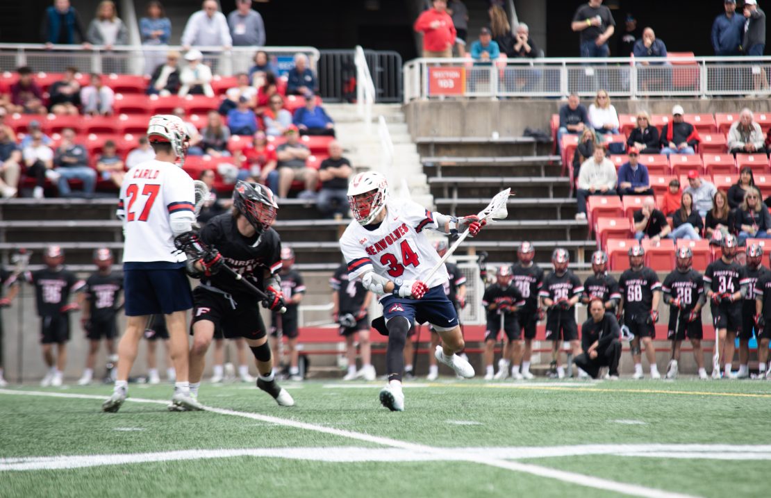 Attackman Dylan Pallonetti gets a screen from midfielder Sean Carlo in a game against Fairfield on Saturday, April 22. Pallonetti scored six points with five goals and an assist in the win. BRITTNEY DIETZ/THE STATESMAN
