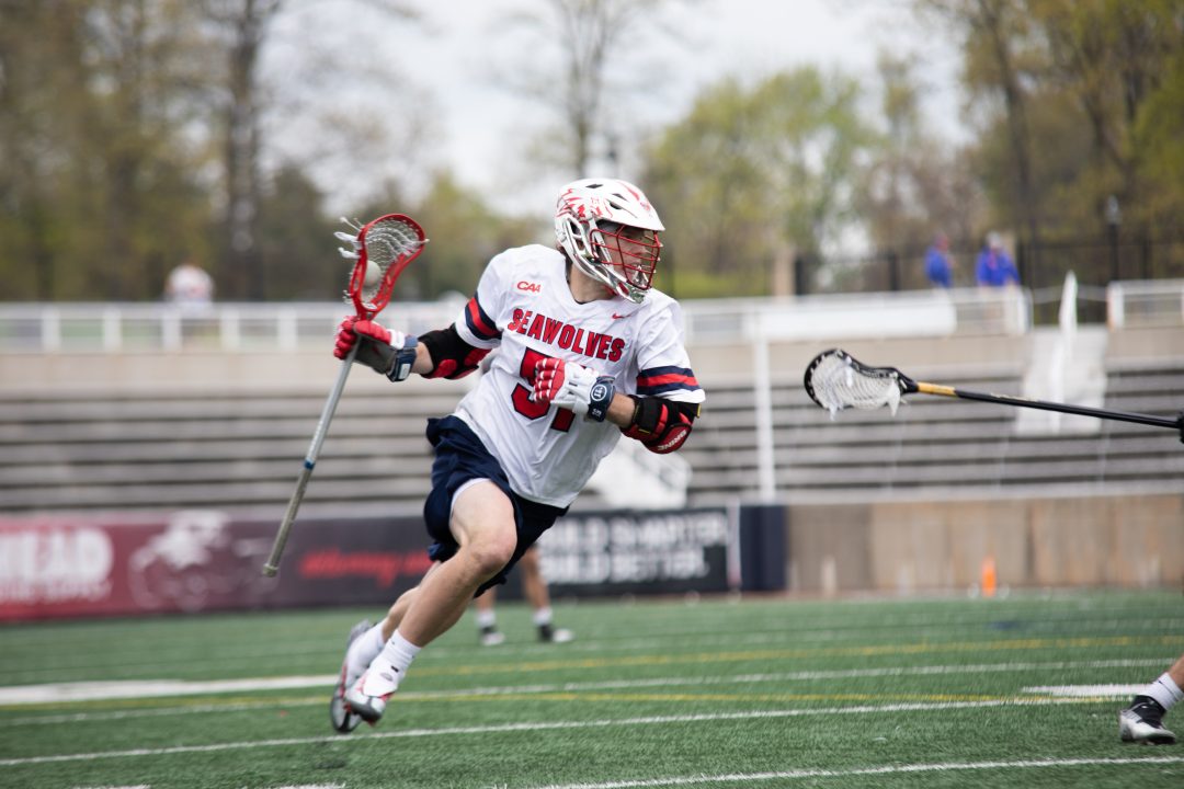 Midfielder Matt Anderson  takes the ball upfield into enemy territory in a game  against Fairfield on Saturday, April 22. Anderson scored five points with four goals and an assist on Saturday in a win against Hofstra. BRITTNEY DIETZ/THE STATESMAN